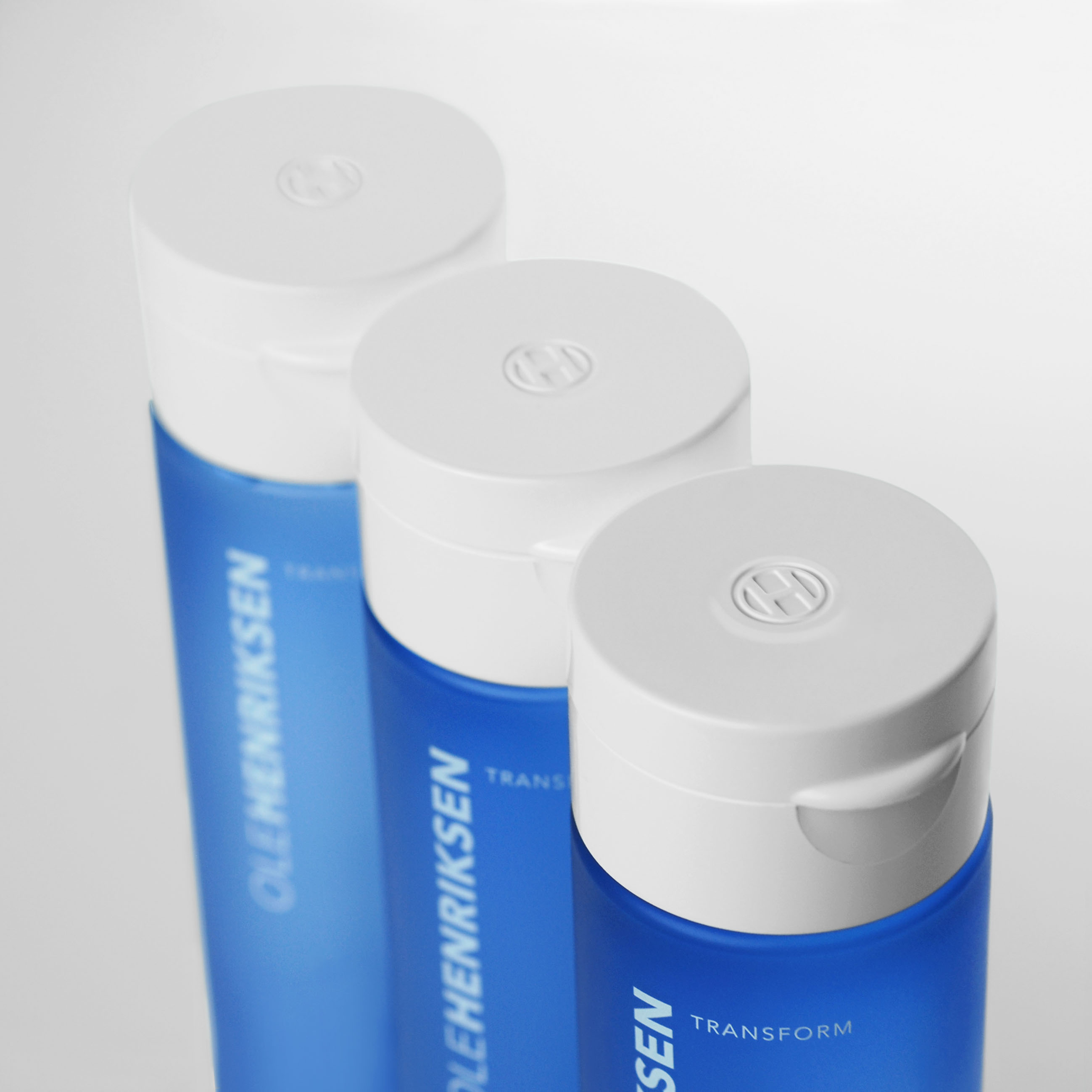 Textured molding flip-top caps for OLE HENRIKSEN Skincare